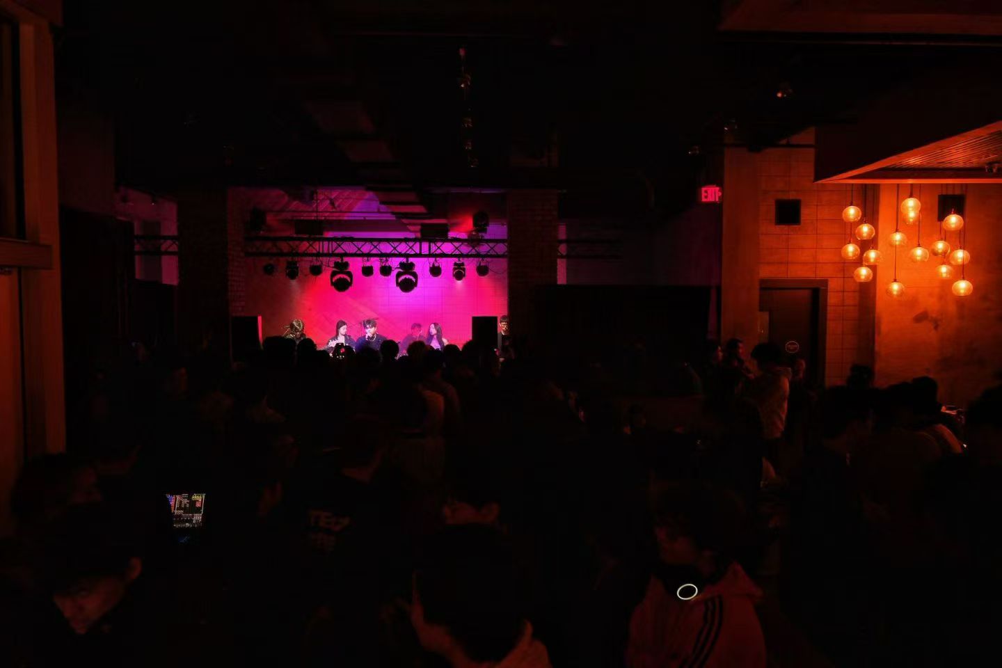 Audience watching a band in a live music venue