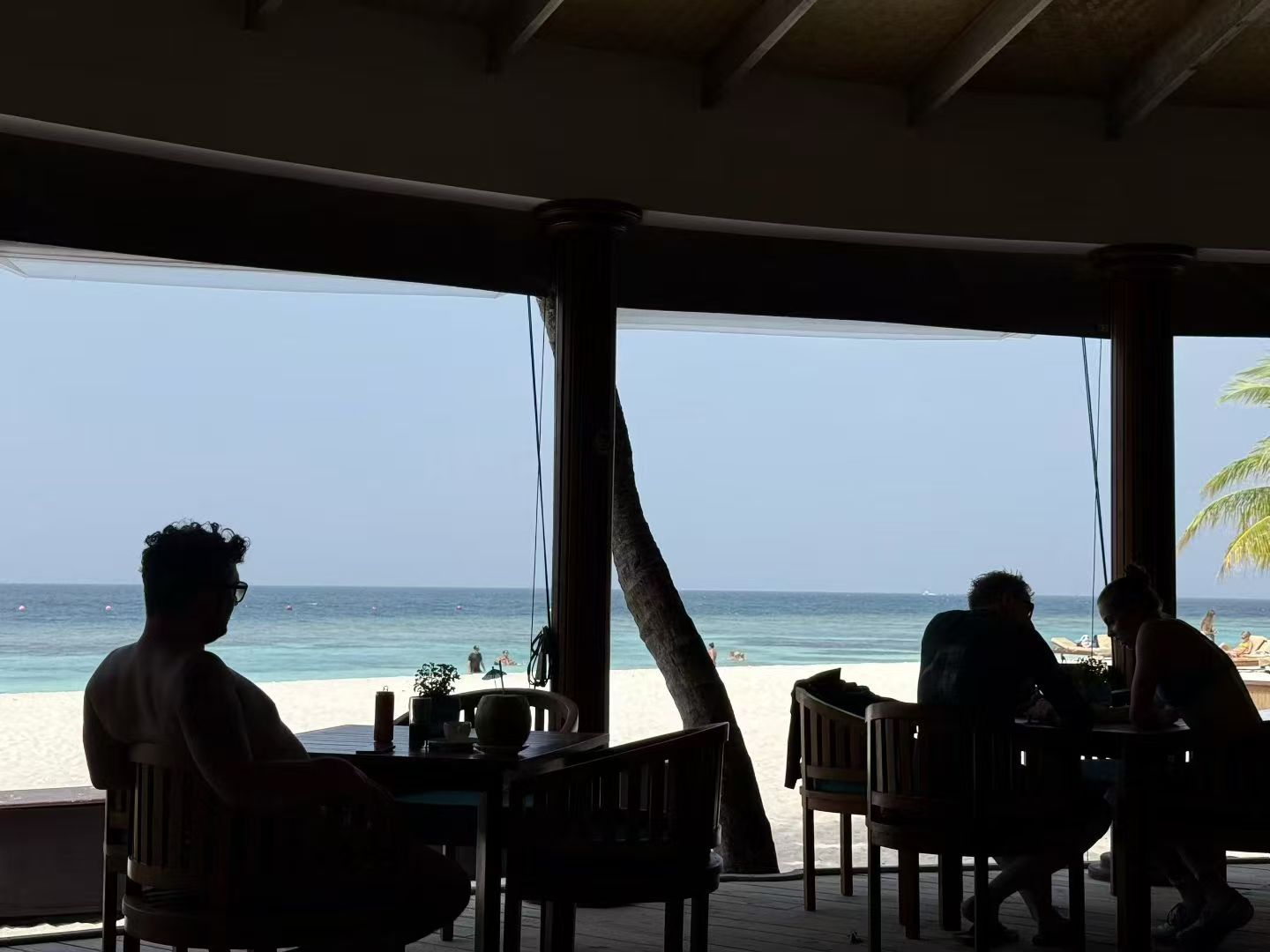 Beach seen from a shaded seaside café